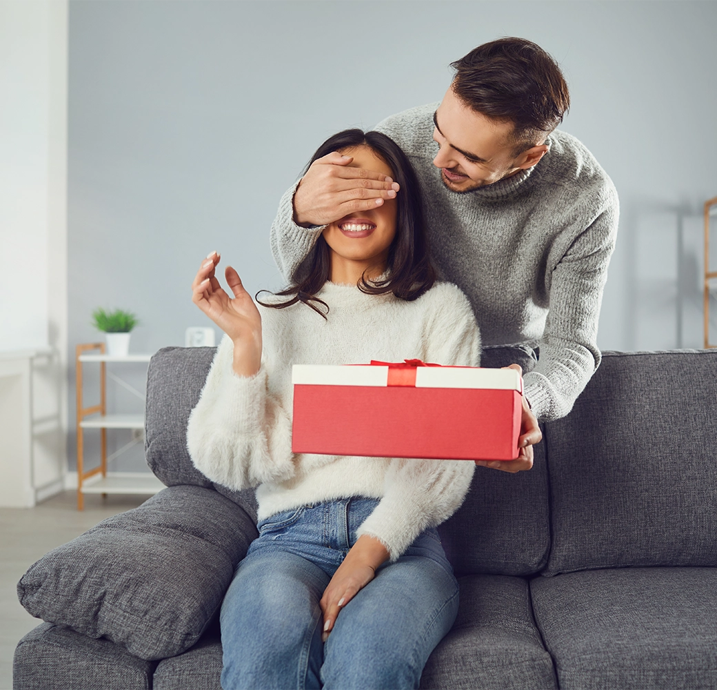 Man surprising woman with valentines gift