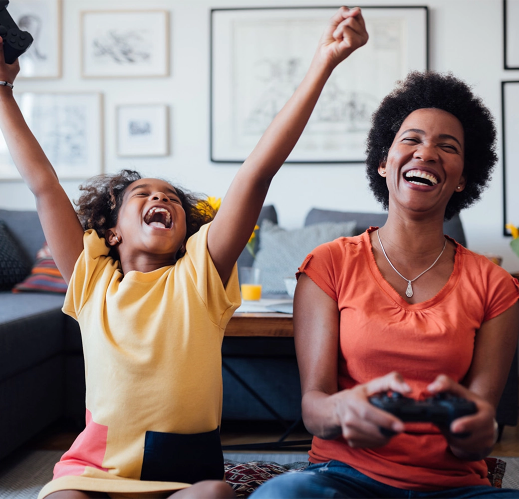 Mother and daughter playing a video game