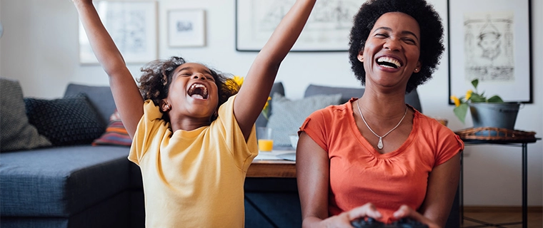 Mother and daughter playing a video game