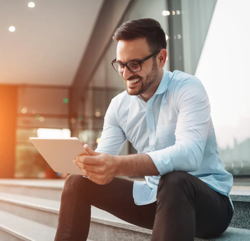 Business man smiling and reading documents