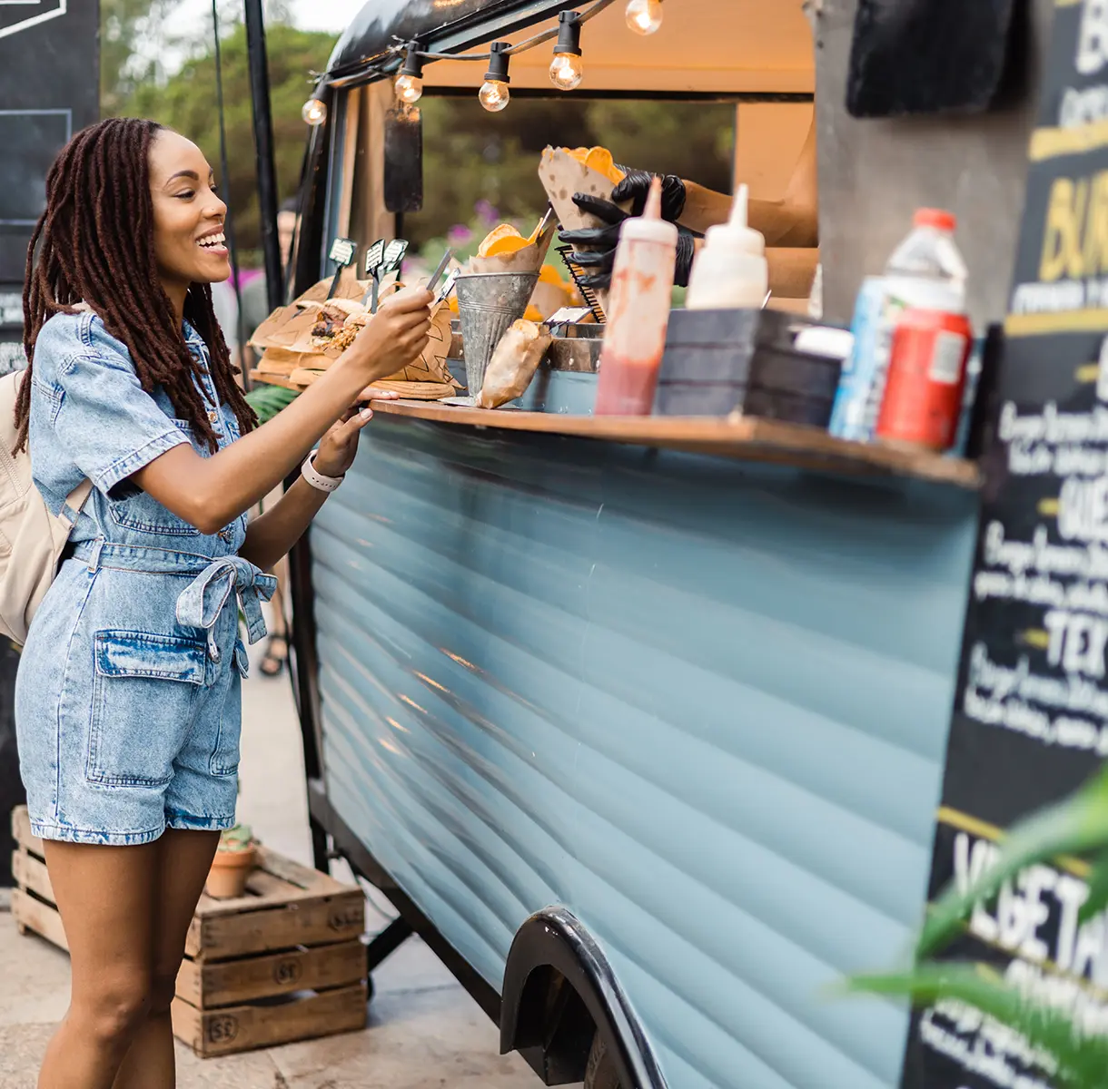 Woman buying food from food truck