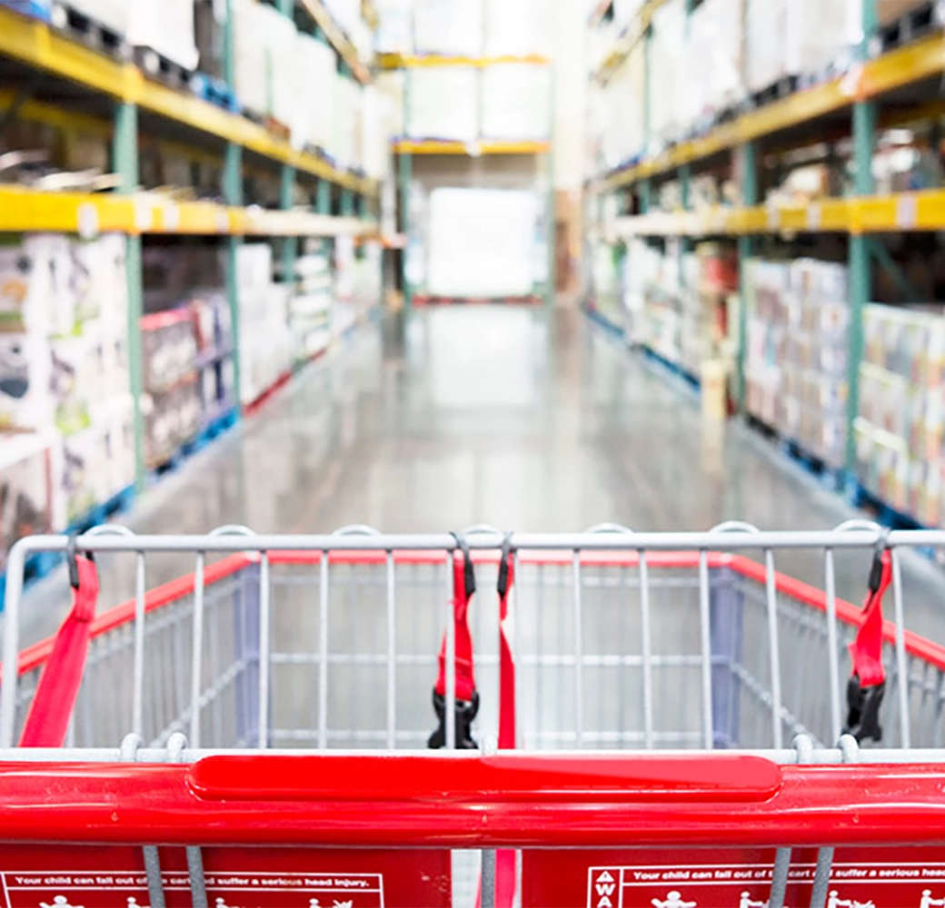 Shopping cart in an aisle of a warehouse club