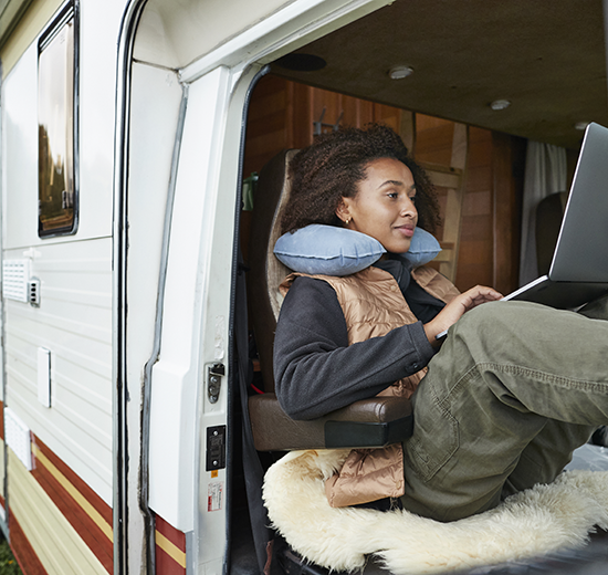 Woman in camper on computer