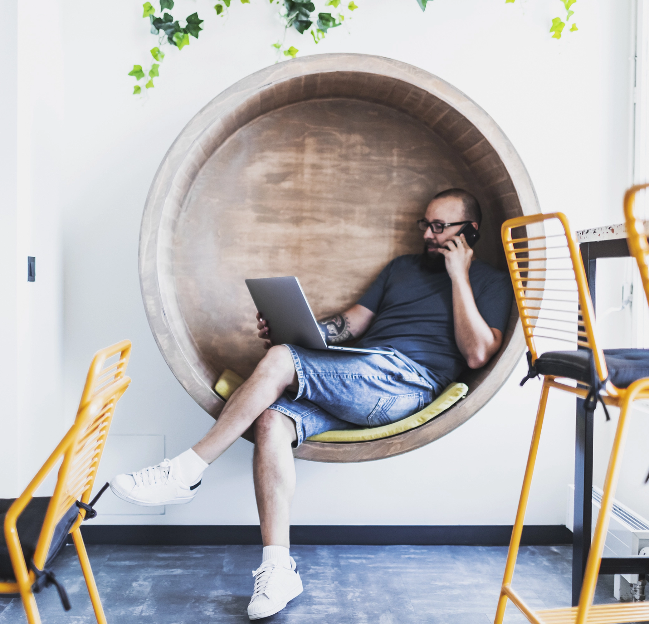 Man relaxing and working on a laptop