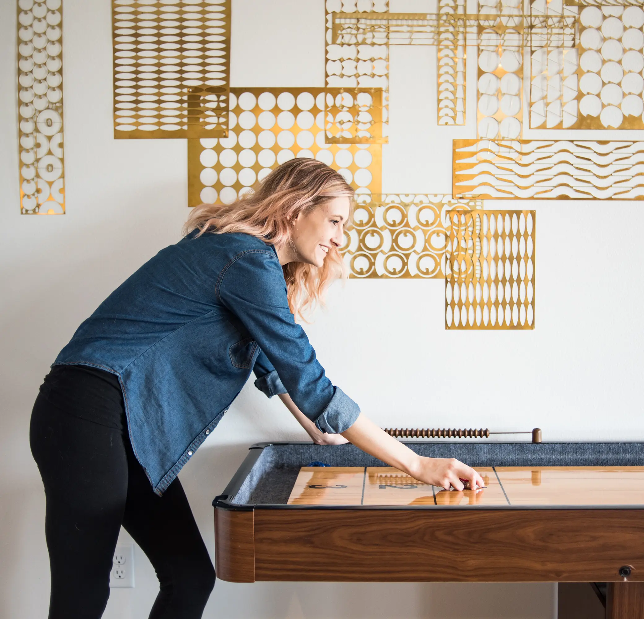 Woman playing shuffleboard