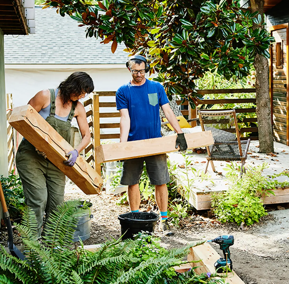 Couple building raised garden beds