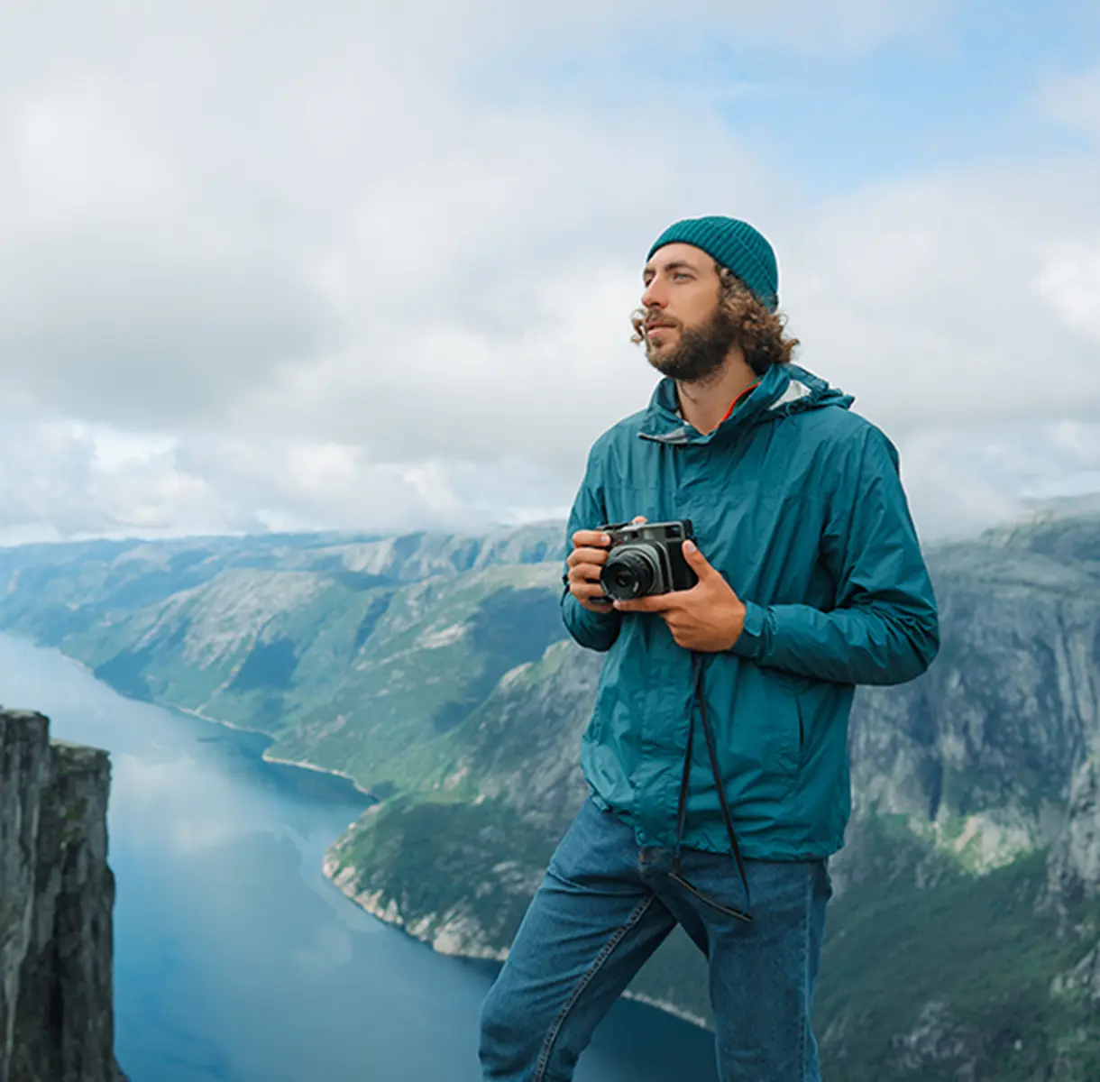 Man about to take a picture with his camera in nature