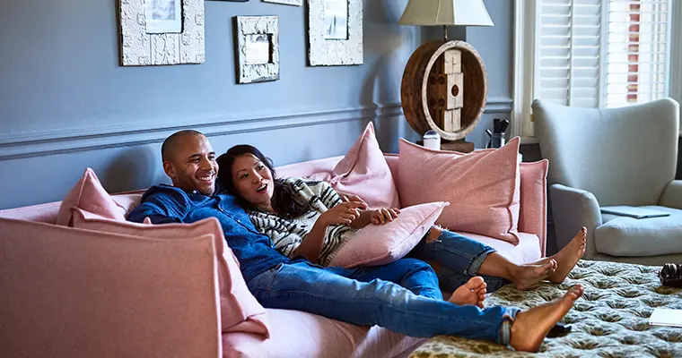 Couple on the couch at home