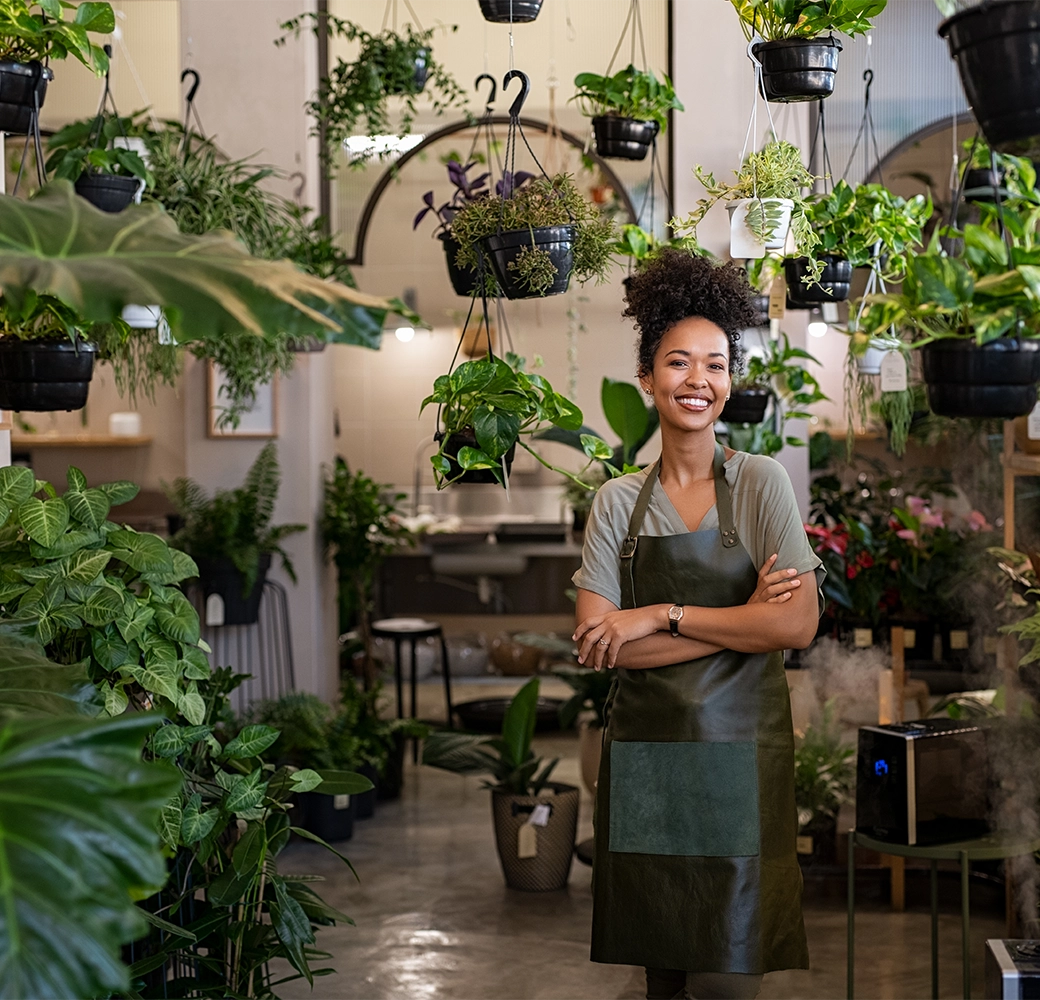 Female business owner standing in her plant shop