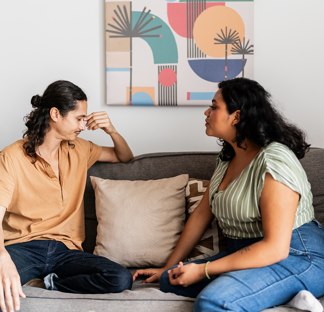 Couple arguing on the couch