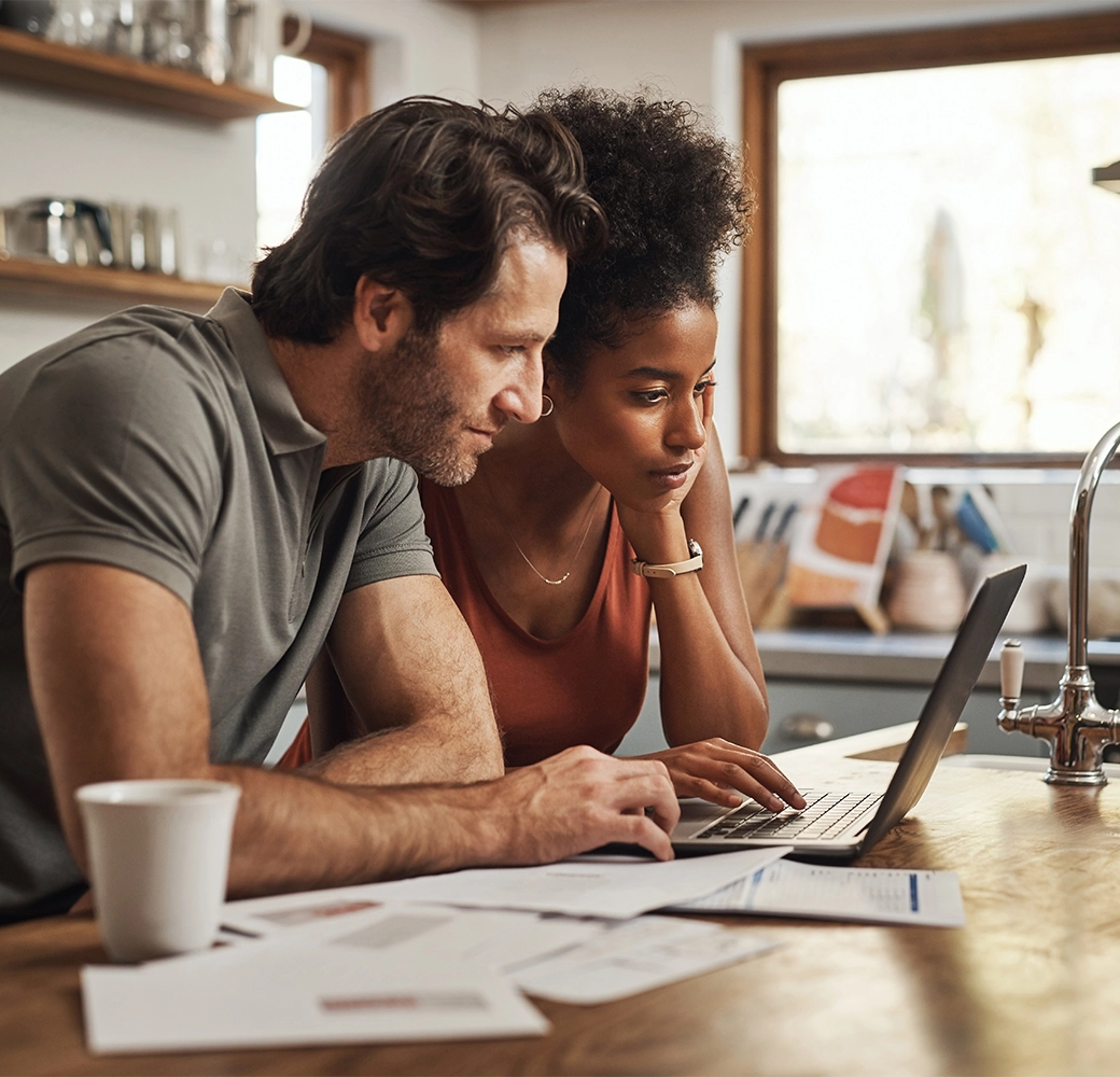 Couple looking at laptop